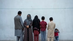 Najia, second left, pose with her family in Kabul, Afghanistan, Oct. 1, 2021. Soon after the Taliban took control of Kabul, the family sold their households and used the money to try to cross into Pakistan.