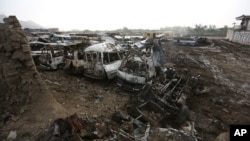FILE - Destroyed cars are seen on the ground after a Taliban-claimed deadly suicide attack in Kabul, Afghanistan, April 20, 2016. Afghan President Ghani has vowed to intensify his military response to the insurgency.