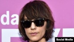 Disabled children cover each other in colored powder during Holi celebrations in Mumbai, India.