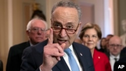 FILE - Senate Minority Leader Chuck Schumer, Democrat-New York, is flanked by colleagues, during a news conference, at the Capitol in Washington, Nov. 14, 2018.