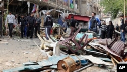 Sebuah serangan bom menghacurkan sebuah cafe di Baghdad, Irak (21/11)