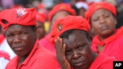 Women listen to political address by the head of the opposition Movement for Democratic Change in Harare, May, 19, 2013.