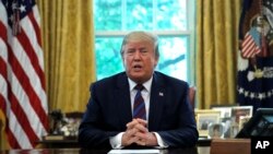 Presiden AS Donald Trump ketika berbicara dengan media di White House, Washington, 26 Juli 2019. (Foto: AP/Carolyn Kaster)