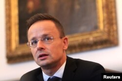 FILE - Hungarian Foreign Minister Peter Szijjarto attends an interview with Reuters in Budapest, Hungary, Sept. 12, 2017.