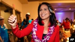 FILE - Rep. Tulsi Gabbard, D-Hawaii, greets supporters in Honolulu, Nov. 6, 2018. Gabbard has announced she’s running for president in 2020.