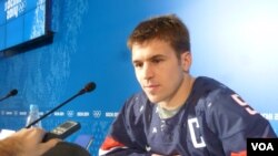 Zach Parise, the captain of the US Olympic ice hockey team, speaks to the media in Sochi, Feb. 11, 2014. (Parke Brewer/VOA)