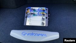 FILE - The new Snapdragon Ride autonomous driving computing system is seen in the trunk of a demo car at the Consumer Electronics Show (CES) in Las Vegas, Nevada, Jan. 5, 2020. 