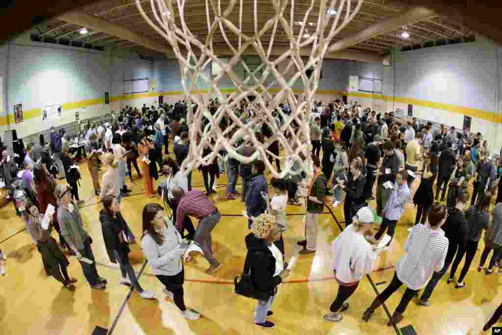 People wait to vote on Super Tuesday in the gymnasium at Cleveland Park Community Center in Nashville, Tenn., March 3, 2020.