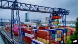 Containers are pictured in the harbor in Frankfurt, Germany,