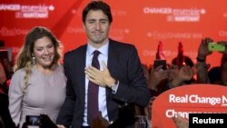 Liberal Party leader Justin Trudeau stands with his wife, Sophie Gregoire, as he gives his victory speech after Canada's federal election in Montreal, Quebec, Oct. 19, 2015. (REUTERS/Chris Wattie)