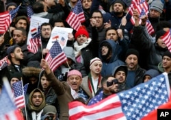Muslims and Yemenis gather with their supporters on the steps of Brooklyn's Borough Hall, during a protest against President Donald Trump’s temporary travel ban on citizens from seven predominantly Muslim countries, Thursday, Feb. 2, 2017