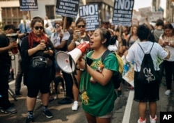 Activists shout slogans during a protest against President Donald Trump's immigration policies in New York, Sept. 5, 2017.