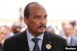 Mauritania's President Mohamed Ould Abdel Aziz waits for the arrival of the French President at Nouakchott airport, Mauritania, July 2, 2018.