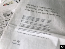 FILE - An advertisement in The New York Times is displayed, March 25, 2018, in New York. Facebook’s CEO apologized for the Cambridge Analytica scandal with ads in multiple U.S. and British newspapers.