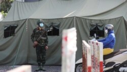 FILE - A military checkpoint is seen during lockdown amid the COVID-19 pandemic in Ho Chi Minh, Vietnam, August 23, 2021.