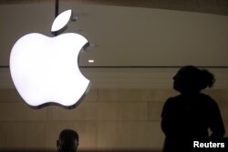 FILE - The Apple logo is pictured at Grand Central Terminal in the Manhattan borough of New York, Feb. 21, 2016.