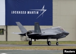 FILE - A RAF Lockheed Martin F-35B fighter jet taxis along a runway after landing at the Royal International Air Tattoo at Fairford, Britain, July 8, 2016.