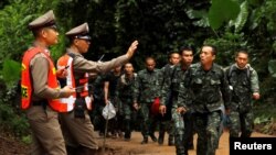 Soldiers arrive outside the Tham Luang cave complex in the northern province of Chiang Rai, Thailand, July 8, 2018.
