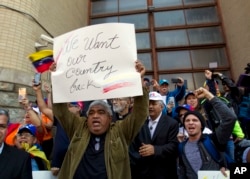 Opposition leader Juan Guaido supporters celebrate during the eviction and arrest of Nicolas Maduro's supporters from the Venezuelan Embassy in Washington, May 16, 2019.