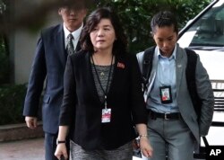 FILE - In this June 11, 2018 file photo, North Korean Vice Foreign Minister Choe Son Hui, center, arrives for a meeting with U.S. Ambassador to the Philippines Sung Kim at the Ritz-Carlton Millenia Hotel in Singapore ahead of the summit between U.S and North Korea.