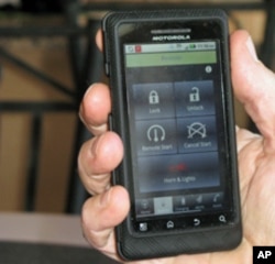 Jeff Parmet starts his Volt inside on a cold day using an application on his mobile phone.