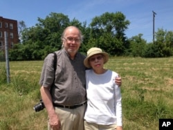 In this July 6, 2017 photo, David and Theresa Welsh revisit the neighborhood where they lived when the Detroit riot started on July 23, 1967.