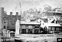FILE- An undated photo of John Brown's Fort shows the entrance of the Armory Grounds at Harpers Ferry, West Virginia. Brown and his followers used the fire engine and guard house as their fort when they raided the U.S. armory and arsenal on Oct. 16, 1859.