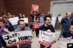 Protesters gather outside the federal courthouse in Boston where U.S. Attorney General Jeff Sessions was speaking to law enforcement officials about transnational organized crime, Sept. 21, 2017.
