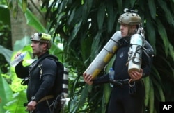 International rescuers prepare to enter the cave where a young soccer team and their coach are trapped by floodwaters, July 5, 2018, in Mae Sai, Chiang Rai province, in northern Thailand.