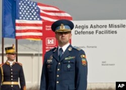 A Romanian officer awaits the ceremony marking the construction of a U.S. Aegis Ashore missile defense base in Deveselu, Romania, October 28, 2013.