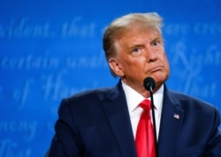 U.S. President Donald Trump participates in the final 2020 U.S. presidential campaign debate with Democratic presidential nominee Joe Biden at Belmont University in Nashville, Tennessee, U.S., October 22, 2020. REUTERS/Jonathan Ernst