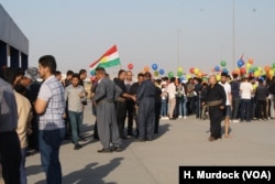 Students gather to protest Baghdad's decision to cancel international flights to and from the Kurdistan Region of Iraq, while mourning families wait for the bodies of their loved ones to return on the last flight from Turkey on Sept. 29, 2017.