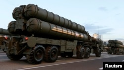 FILE - Russian S-400 air defense mobile missile launching systems take part in a military parade in Minsk, July 3, 2014.