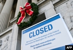 A sign is displayed at the National Archives building that is closed because of a U.S. government shutdown in Washington, Dec. 22, 2018.