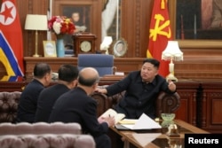 North Korean leader Kim Jong Un meets with the delegation that had visited the United States, in Pyongyang, in this photo released by North Korea's Korean Central News Agency, Jan. 23, 2019.