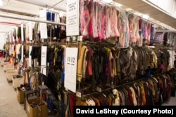 The TDF costume collection is displayed in 12 very long aisles, three and four tiers high.