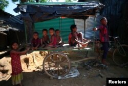 Rohingya refugee children play in Kutupalong refugee camp near Cox's Bazar, Bangladesh, Nov. 6, 2017.