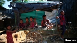 Rohingya refugee children play in Kutupalong refugee camp near Cox's Bazar, Bangladesh, Nov. 6, 2017.