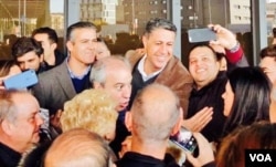 Xavier Garcia Albiol, the top regional politician of Spain's ruling Popular Party, poses with supporters in Barcelona on voting day, Dec. 21, 2017. The party opposes Catalan separatism. (G. Tobias/VOA)