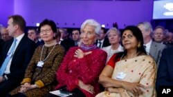 IMF Director Christine Lagarde listens as President Donald Trump delivers a speech to the World Economic Forum, Friday, Jan. 26, 2018, in Davos. (AP Photo/Evan Vucci)