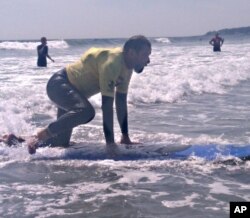 Stricken with polio at an early age, Brian Foss, 57, uses crutches but still enjoys skiing, bicycling and surfing.