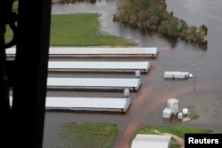 A flooded farm is seen during a flight by a U.S. Customs and Border Protection helicopter after the passing of Hurricane Florence, now downgraded to a tropical depression, over central North Carolina, Sept. 16, 2018.