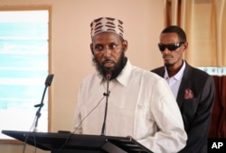FILE - Mukhtar Robow, once deputy leader of Africa's deadliest Islamic extremist group the al-Shabab, speaks at a press conference about his candidacy for a regional presidency, in Baidoa, Somalia, Oct. 10, 2018.