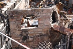 A tandoor that was used in the former Gandhi Mahal Restaurant remains among the ruins. (K. Khan/VOA)