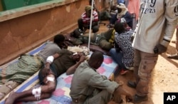 Wounded Malian troops receive medical treatment after being injured by an explosion at the Joint Operational Mechanism base in Gao, Mali, Jan. 18, 2017.