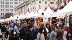 People enjoy food, live entertainment, and support local business at the 17th Annual Downtown Holiday Market, December 18, 2021, Downtown Washington, DC.