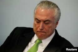 Brazil's President Michel Temer reacts during a ceremony in commemoration of the World Environment Day, at the Planalto Palace in Brasilia, Brazil, June 5, 2017.