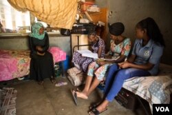 Students meet in their dorm room. They say the university provides ample security, requiring all entrants to show their IDs before they enter the dormitories. (C. Oduah/VOA)