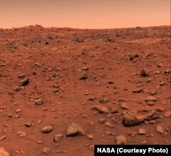 First color image of Mars taken by Viking 1 on July 21, 1976. The original image was calibrated incorrectly showing a blue sky instead of a red one. A correctly calibrated image was released on July 26th 1976.