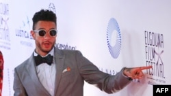 Egyptian actor Ahmed el-Fishawy poses for photos for the film "Sheikh Jackson" as he attends the opening ceremony of the first edition of the El-Gouna Film Festival in Hurghada, Egypt, Sept. 22, 2017.
